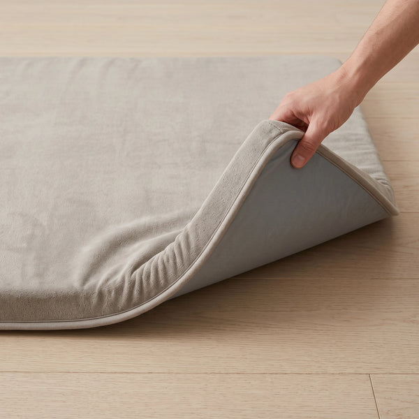 A corner of the mat folded back to show the non-slip backing